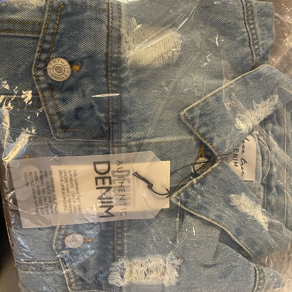Distressed jean jacket.